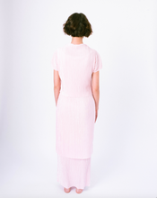Load image into Gallery viewer, Back of pink pleated tiered maxi dress with mock neck and short sleeves on woman
