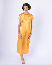 Load image into Gallery viewer, front gold colored satin maxi tshirt dress with side slit on woman
