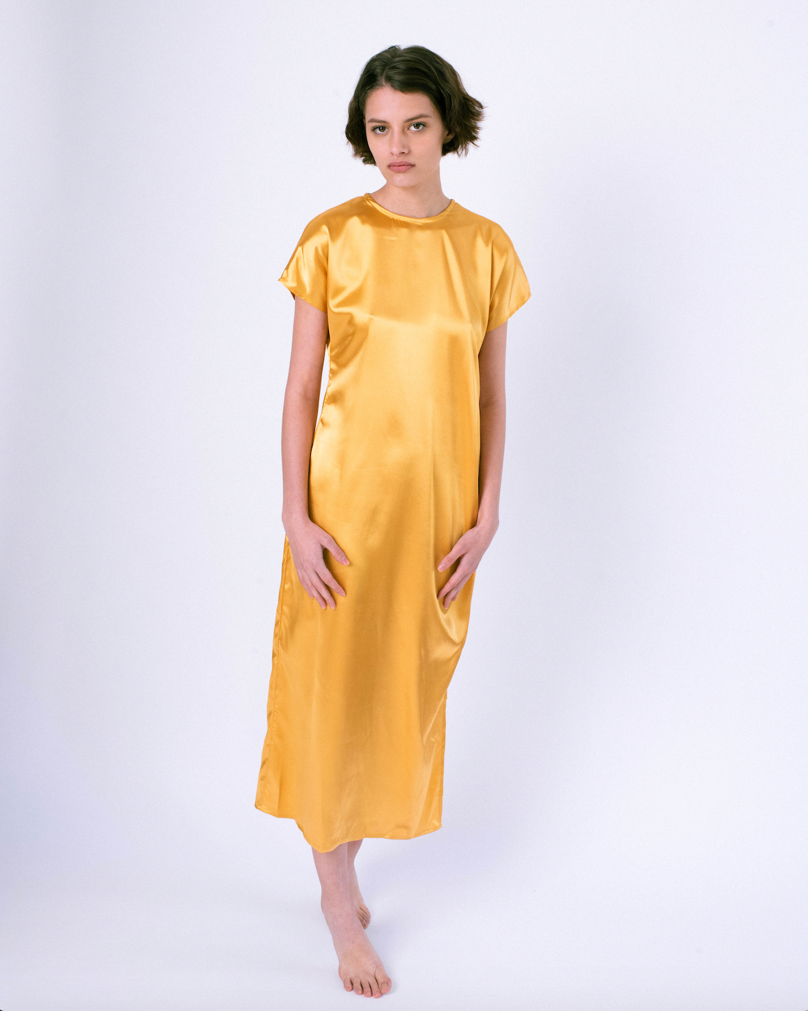 front gold colored satin maxi tshirt dress with side slit on woman