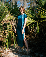 Load image into Gallery viewer, blue satin maxi tshirt dress with side slit on woman  standing in forest
