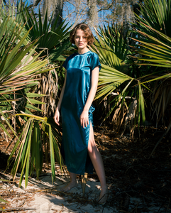 blue satin maxi tshirt dress with side slit on woman  standing in forest