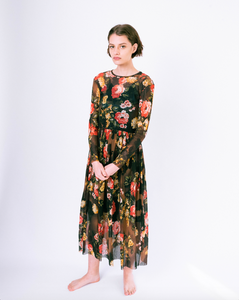 Front of floral print brown mesh overlay a-line dress with long sleeves over attached satin slip on woman